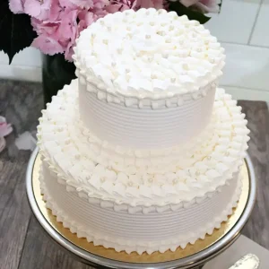 Two tiered wedding cake with elegantly applied white frosting in Vancouver BC