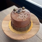 Festive Gingerbread Cake with chocolate bells and chocolate gingerbread man